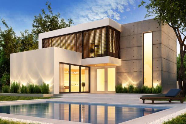 Evening view of a modern house with pool